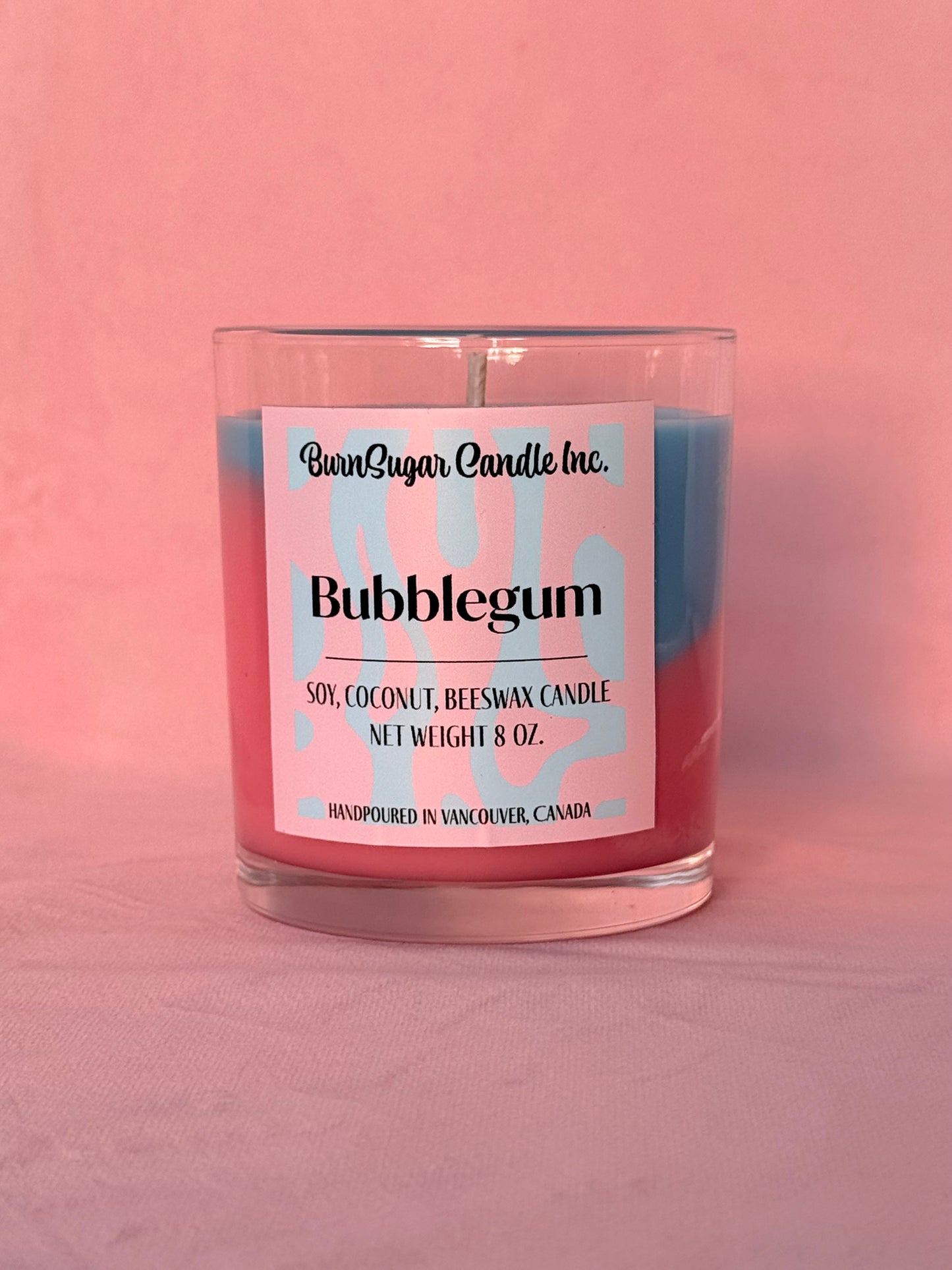 Image of pink and blue bubblegum candle on a pink background