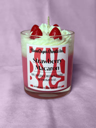 Strawberry Macaron candle with strawberry toppings on a purple background