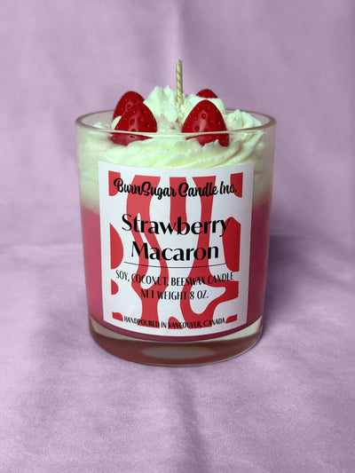 Strawberry Macaron candle with strawberry toppings on a purple background