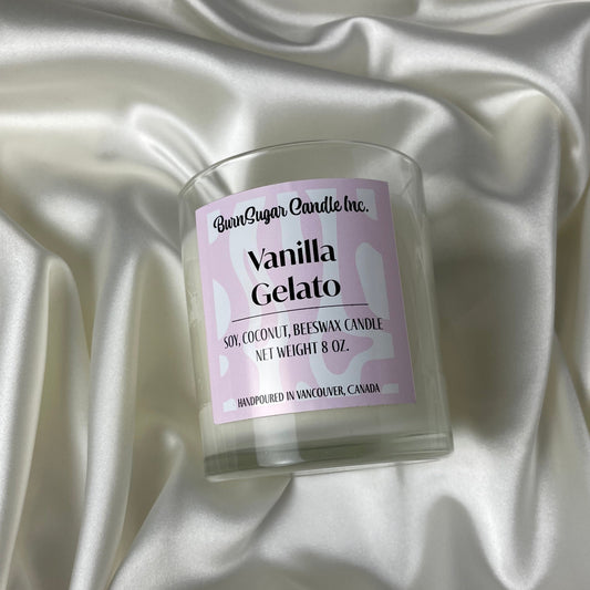 Vanilla Gelato scented candle on a satin surface